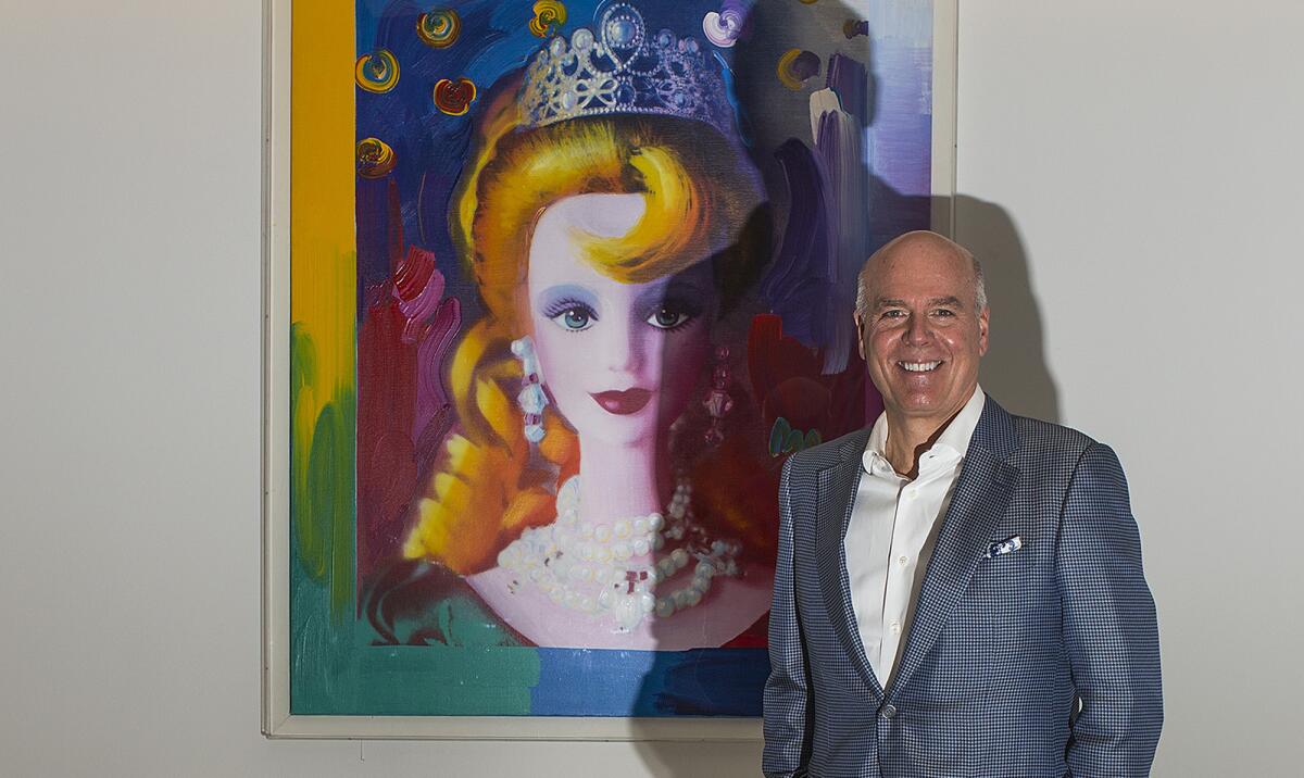 Bryan Stockton is out as chairman and chief executive of Mattel. Above, Stockton in front of a painting of Barbie at the company's headquarters in November.