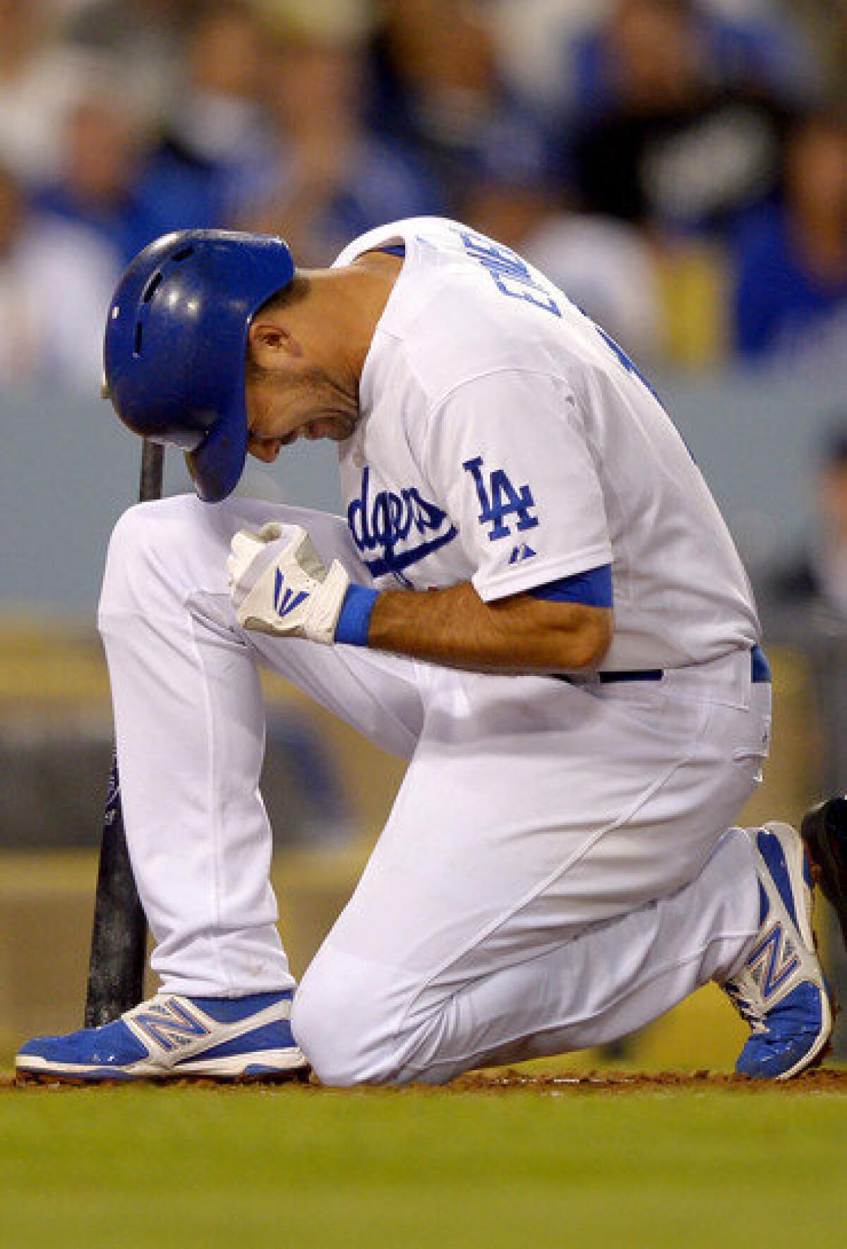 Dodgers' Andre Ethier reacts after being hit with his own foul tip during the fourth inning of Saturday's game against the Atlanta Braves.