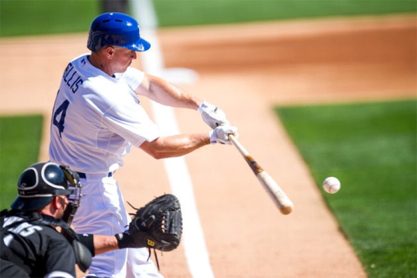Dodgers second baseman Mark Ellis hits against the White Sox during a spring training game.