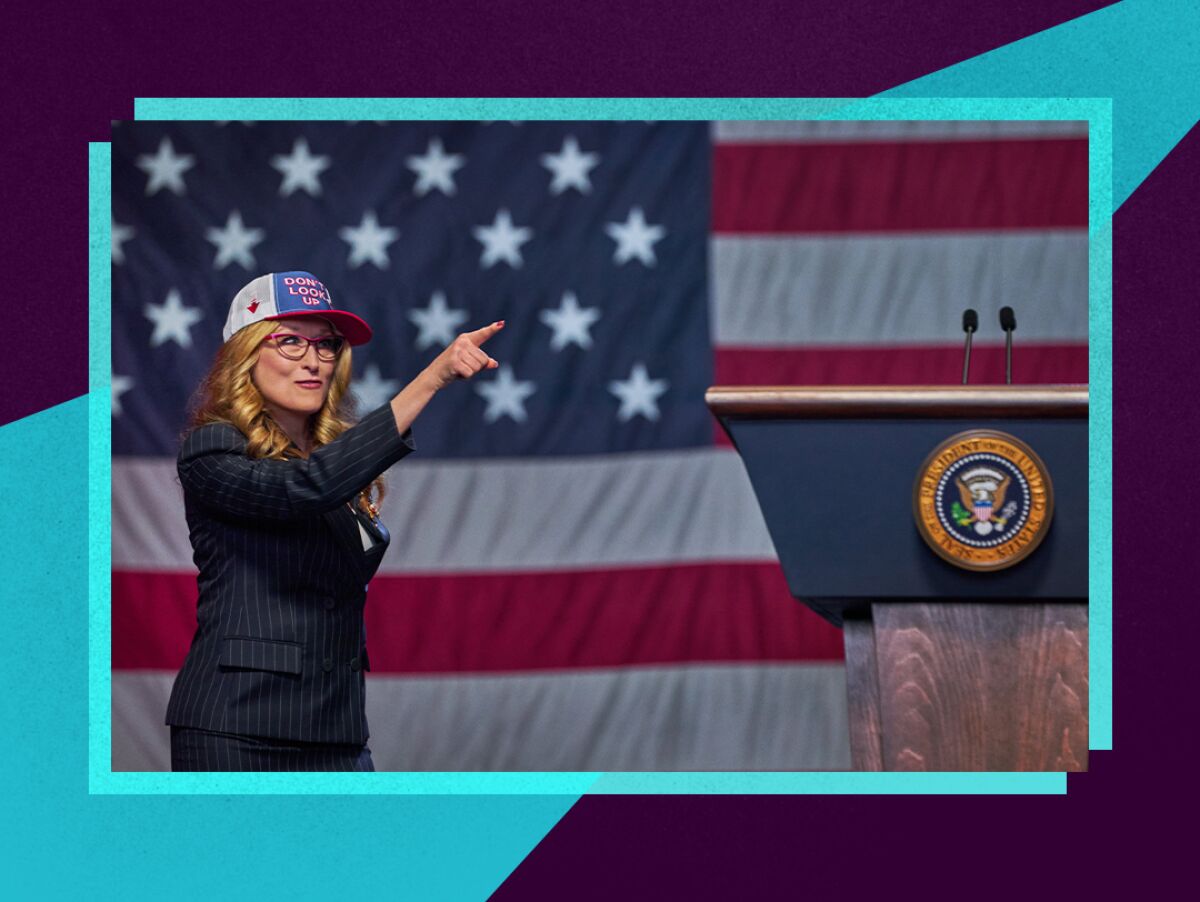 A woman points while approaching a presidential podium in front of an American flag backdrop.