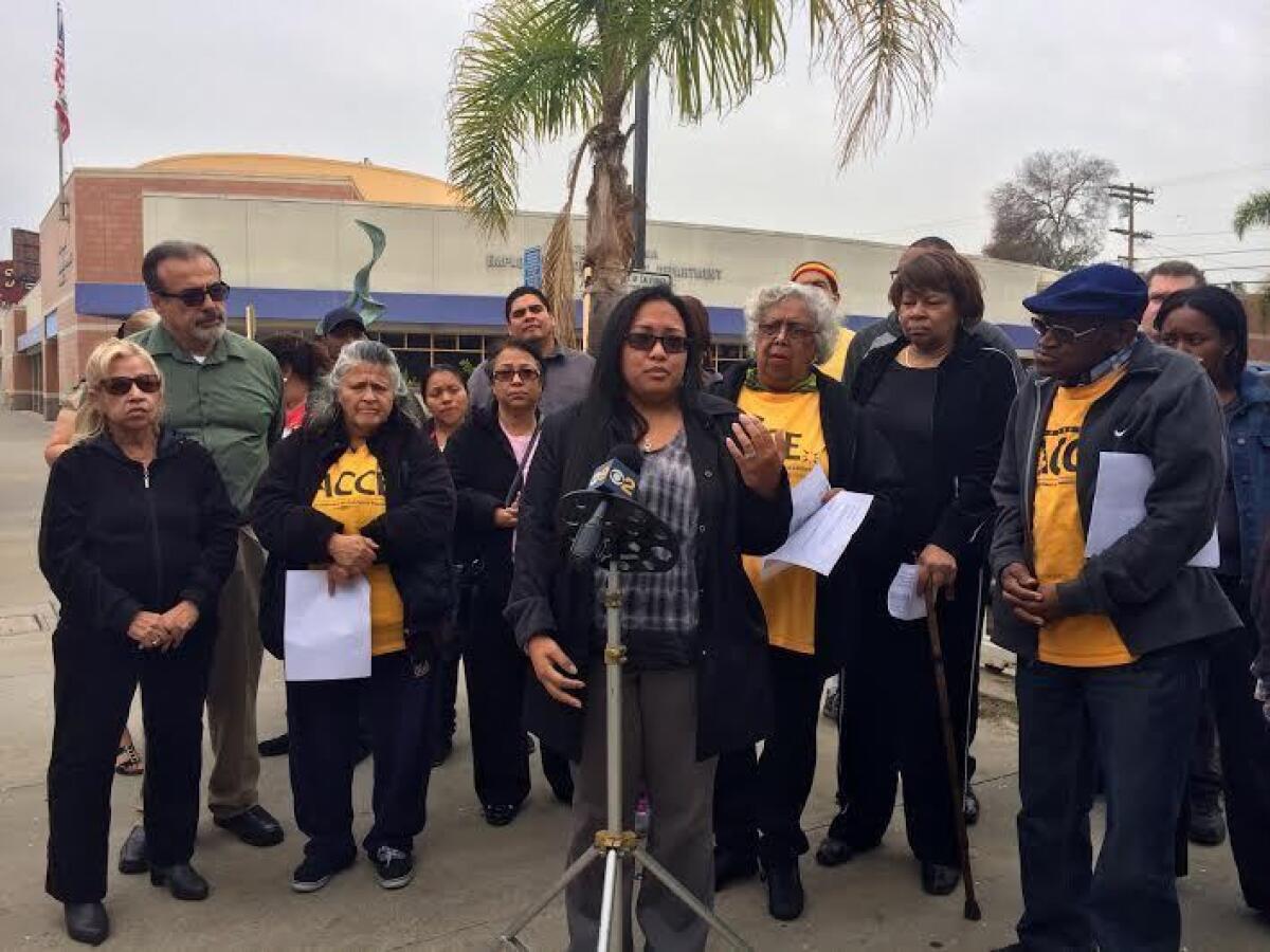 An employee of California's Employment Development Department speaks at a news conference in South Los Angeles on Thursday. Fix Unemployment Now, a campaign seeking to reform the state's unemployment insurance system, is recruiting state residents to join its cause.