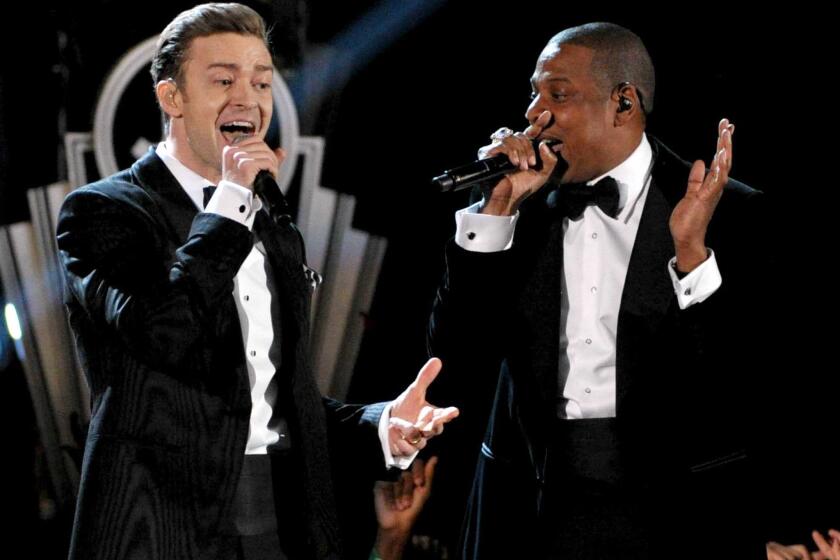 Recording artists Justin Timberlake, left, and Jay-Z, shown performing Feb. 10 at the Grammy Awards in Los Angeles, will play a dozen stadium shows this summer.