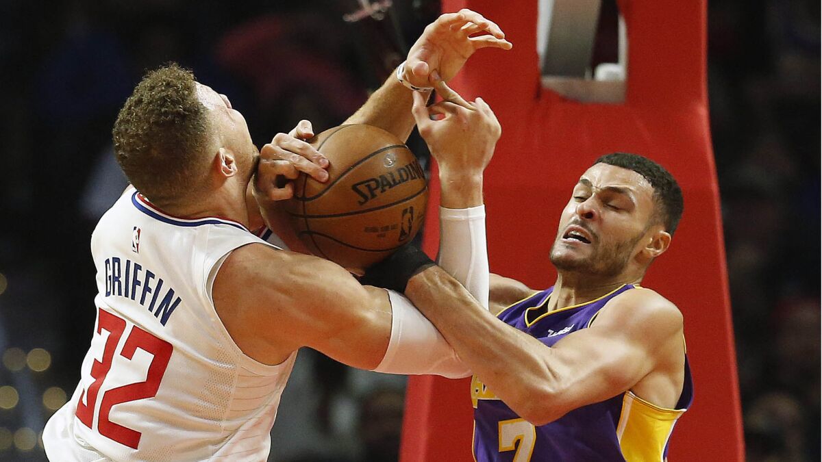 Clippers forward Blake Griffin is tied up for a jump ball with Lakers forward Larry Nance Jr. on Nov. 27.