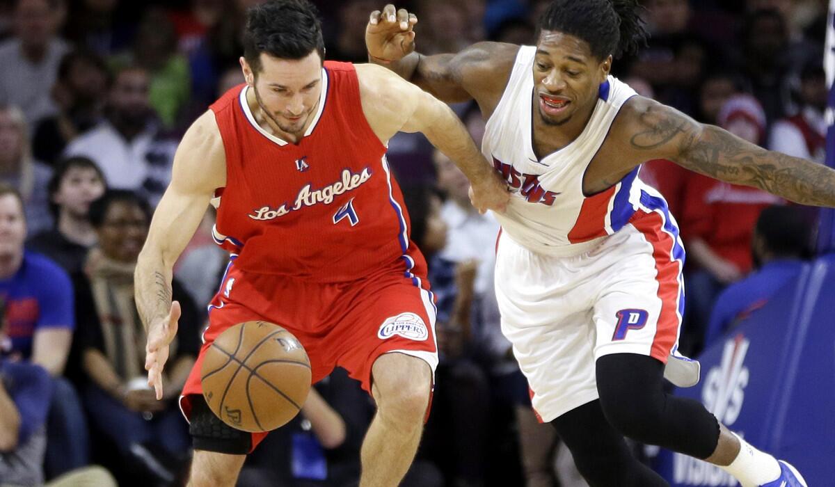 Clippers guard J.J. Redick (4) and Pistons forward Cartier Martin chase after a loose ball during the first half of their game Wednesday in Auburn Hills, Mich.