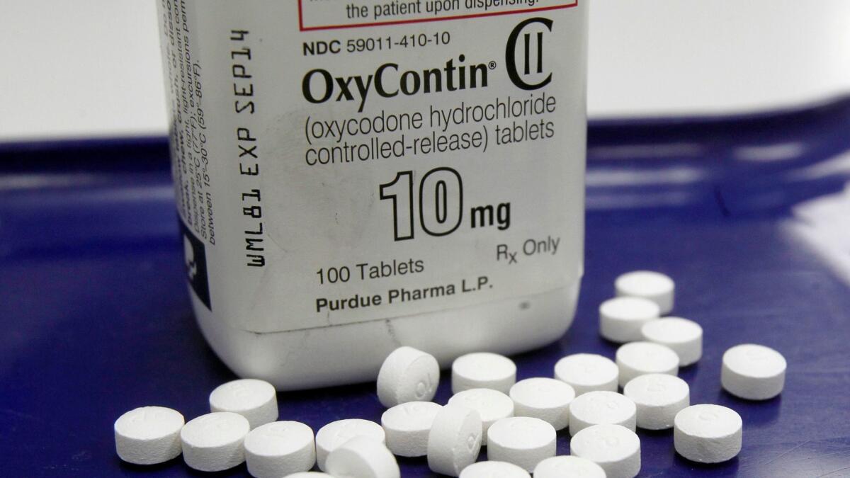 This file photo shows OxyContin pills. On Wednesday, a U.S. Customs and Border Protection officer found 47,340 tablets of oxycodone inside a woman's car at the Otay Mesa border crossing.