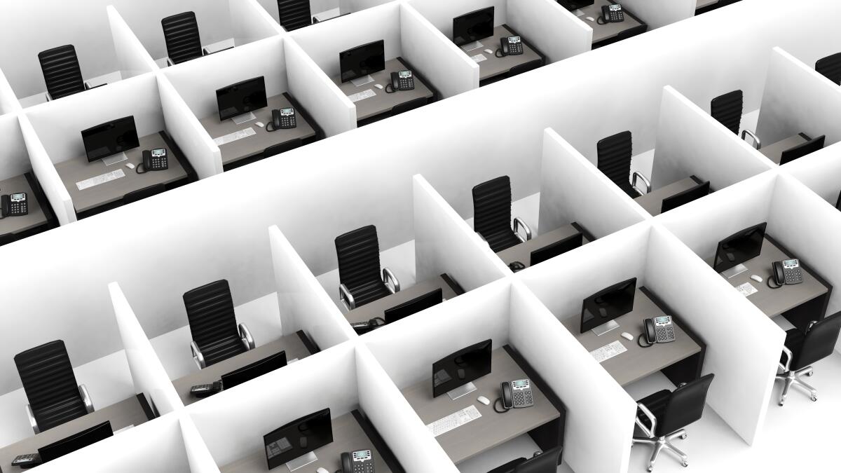 A warren of office cubicles seen from above.