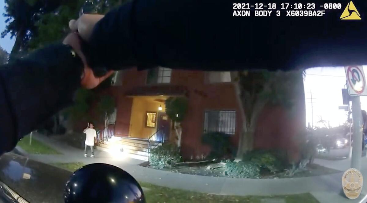 LAPD body camera footage showing an officer aiming a gun at a man