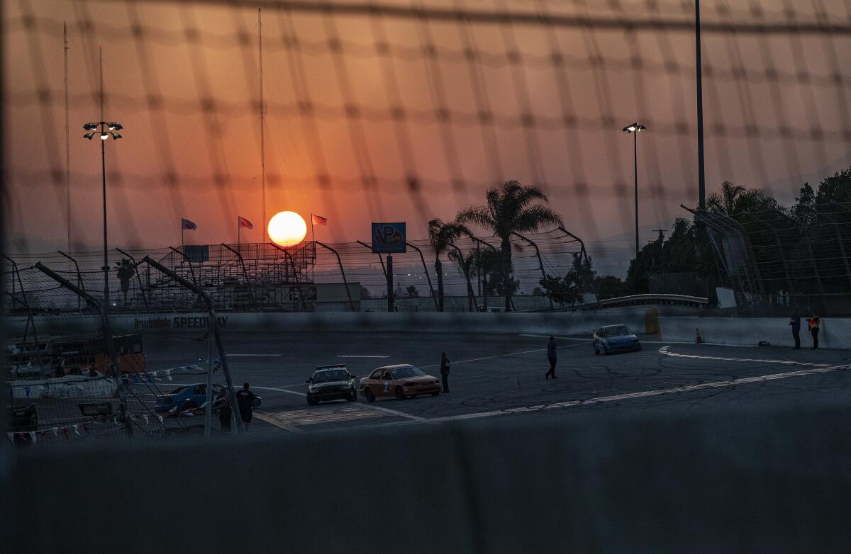 A sunset behind a racetrack