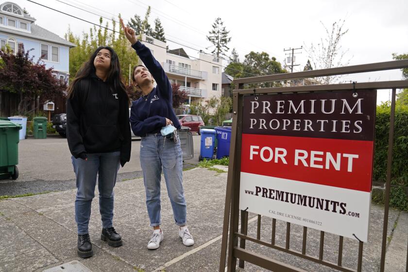 University of California, Berkeley freshmen Sanaa Sodhi, right, and Cheryl Tugade look for apartments in Berkeley, Calif., Tuesday, March 29, 2022. Millions of college students in the U.S. are trying to find an affordable place to live as rents surge nationally, affecting seniors, young families and students alike. Sodhi is looking for an apartment to rent with three friends next fall, away from the dorms but still close to classes and activities on campus. They've budgeted at least $5,200 for a two-bedroom. (AP Photo/Eric Risberg)