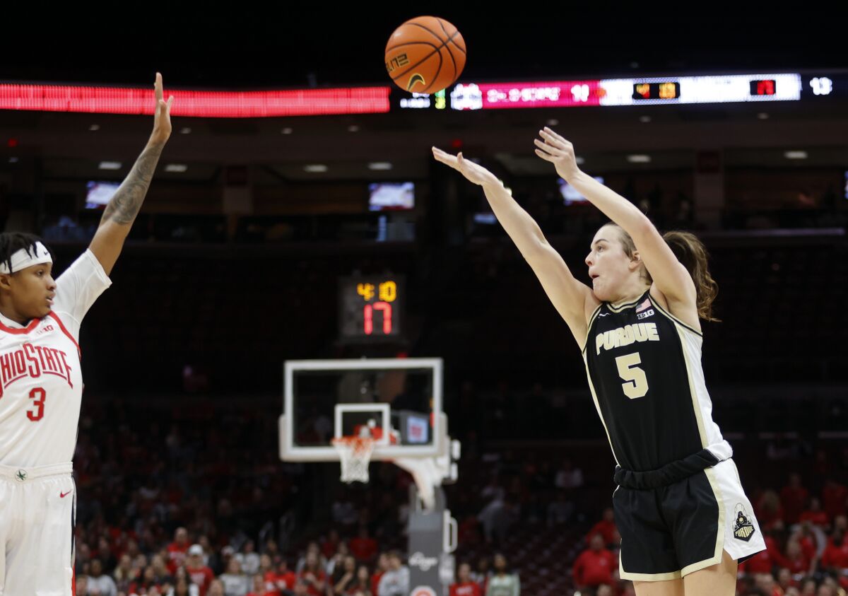 Purdue guard Cassidy Hardin, right, shoots in front of Ohio State guard Hevynne Bristow during the first half of an NCAA college basketball game in Columbus, Ohio, Sunday, Jan. 29, 2023. (AP Photo/Paul Vernon)