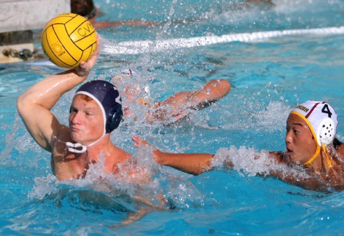 Crescenta Valley High water polo player Julian Bartolone takes a shot on goal in a Pacific League game versus visiting Arcadia High on Wednesday. Crescenta Valley won the game, 14-3.