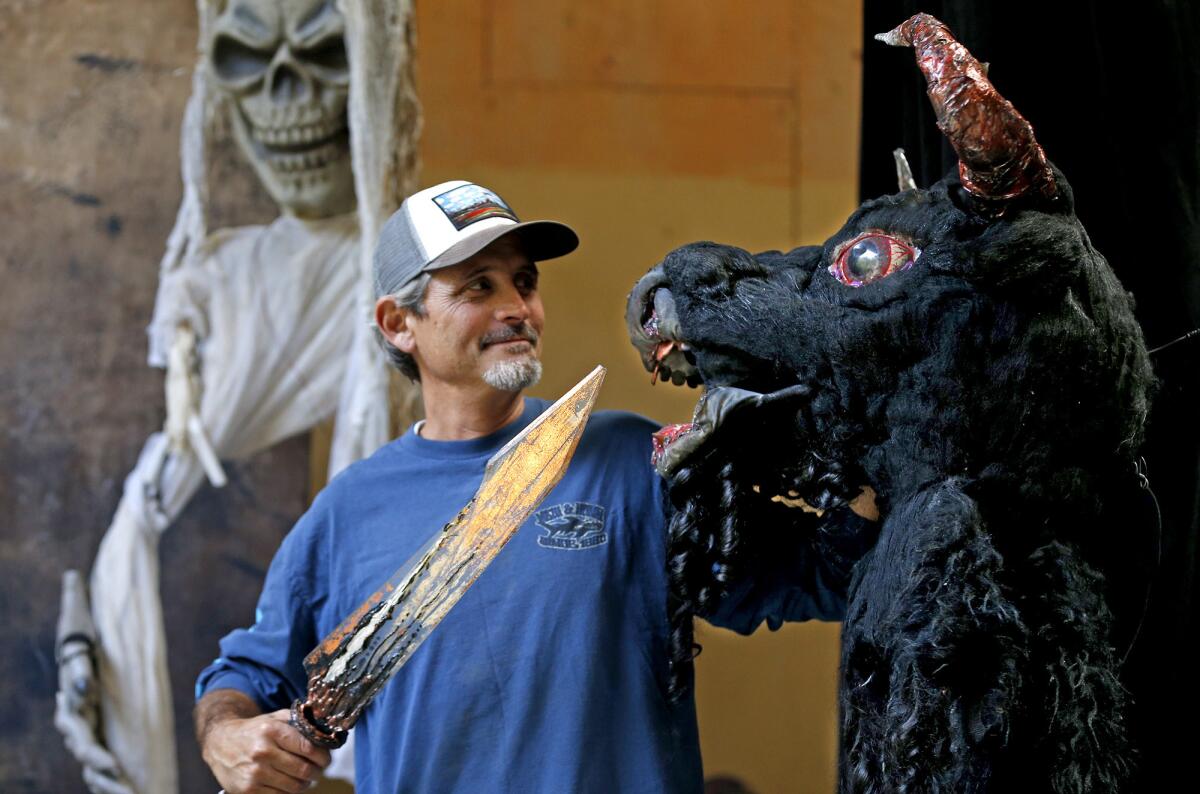 Pageant construction foreman David Talbot with the Minotaur prop that will be part of the Pageant of the Monsters.
