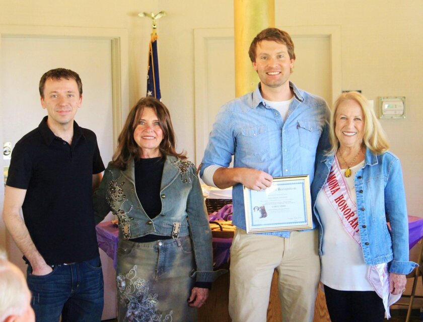 Ramona Honorary Mayor Sharon Davis, right, presents filmmaker Justin Koehler with a proclamation from the town of Ramona during an event highlighting Koehler's documentary about the late Casey Tibbs and his impact on Ramona. From left are videographer Aaron Prendergast, Sandy Tibbs, Koehler and Davis.