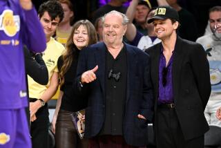 Los Angeles, California April 28, 2023-Actor Jack Nicholson smiles before a Lakers and Grizzlies matchup in Game 6 of the NBA playoffs at Crypto.com arena Friday. No foul was called on the play. (Wally Skalij/Los Angeles Times)