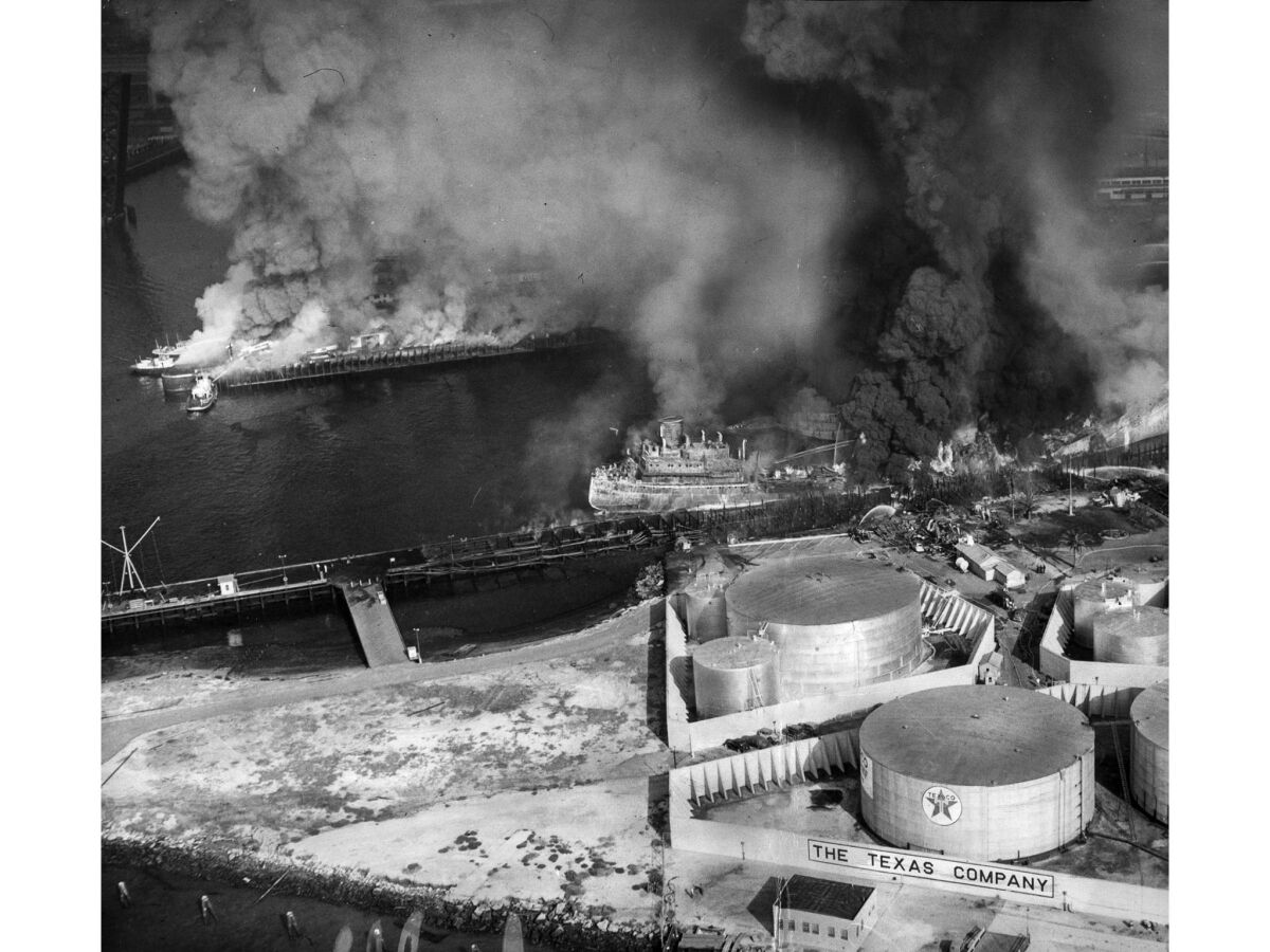 June 22, 1947: The Markay, along dock in channel, burns close to Texas Co. oil storage tanks in foreground. Across channel, docks afire after burning gasoline spread. This photo appeared in the June 23, 1947, Los Angeles Times.