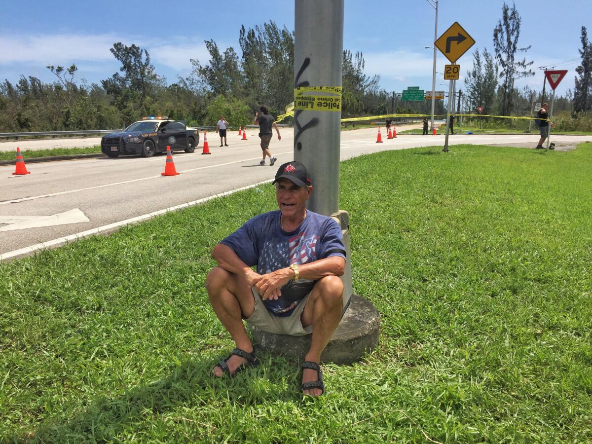 Warren Stincer waits at a checkpoint along Route 1, the only road going in and out of the Florida Keys on Monday.