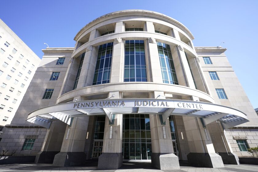FILE - The exterior of the Pennsylvania Judicial Center, home to the Commonwealth Court in Harrisburg, Pa., is pictured on Nov. 6, 2020. A Pennsylvania judge ruled Tuesday, Feb. 7, 2023, that the state's funding of public education falls woefully short, siding with poorer districts in a lawsuit that was first filed eight years ago. (AP Photo/Julio Cortez, File)