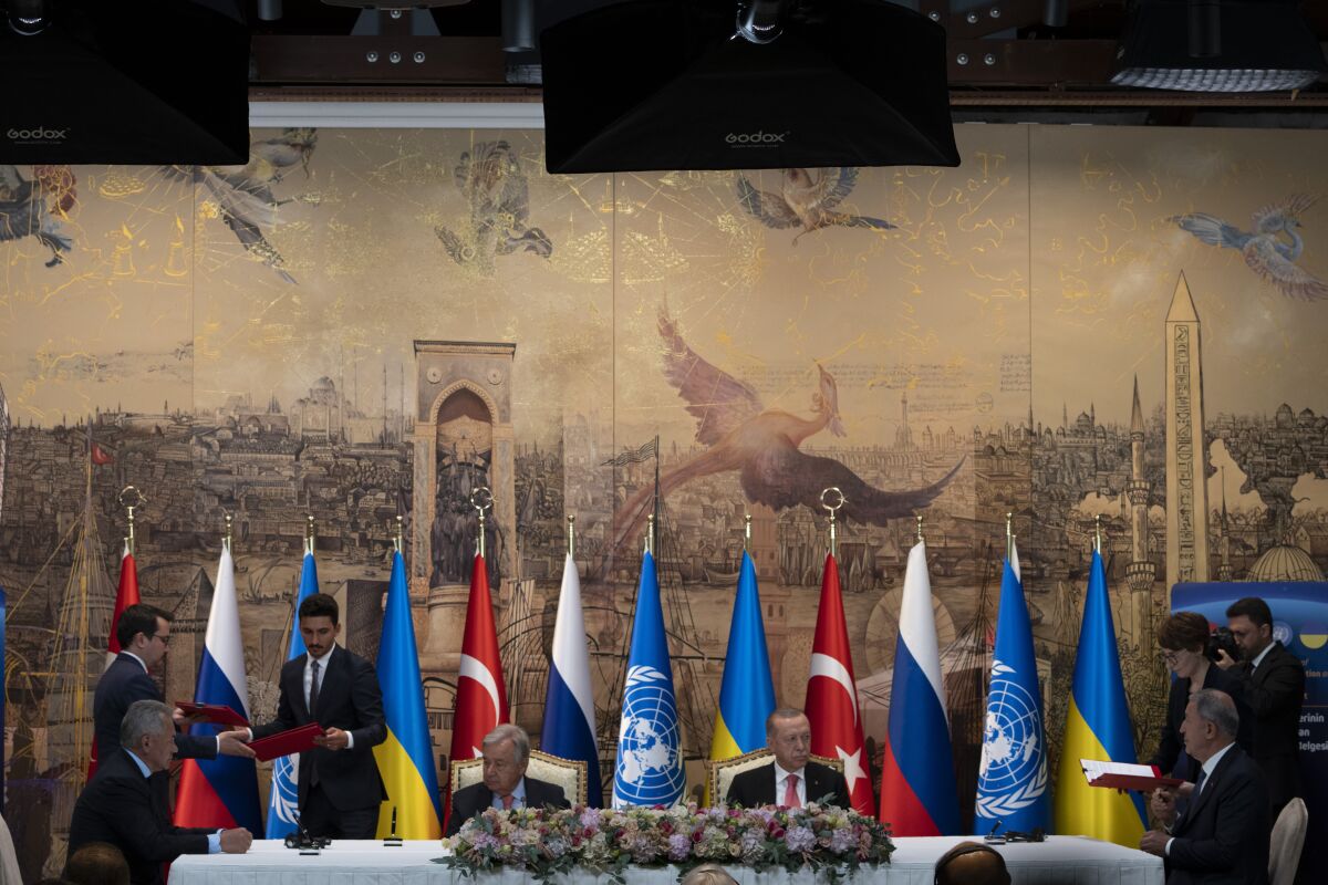 Turkish President Recep Tayyip Erdogan and U.N. Secretary General Antonio Guterres lead a signing ceremony at Dolmabahce Palace in Istanbul, Turkey, Friday, July 22, 2022. U.N. Secretary General Antonio Guterres and Turkish President Recep Tayyip Erdogan were due on Friday to oversee the signing of a key agreement that would allow Ukraine to resume its shipment of grain from the Black Sea to world markets and for Russia to export grain and fertilizers, ending a standoff that has threatened world food security. (AP Photo/Khalil Hamra)