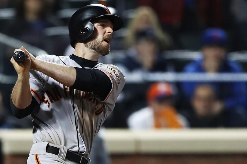 San Francisco Giants' Conor Gillaspie hits a three-run homerun in the ninth inning against the New York Mets during the NL Wild Card game Wednesday.