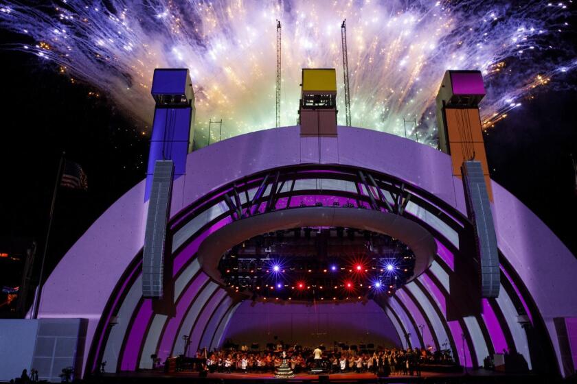 Fireworks light up the night sky as singer Katy Perry performs as Gustavo Dudamel conducts the LA Philharmonic 100th anniversary concert at the Hollywood Bowl on Sunday, September 30, 2018 in Los Angeles, Calif. (Patrick T. Fallon/ For The Los Angeles Times)