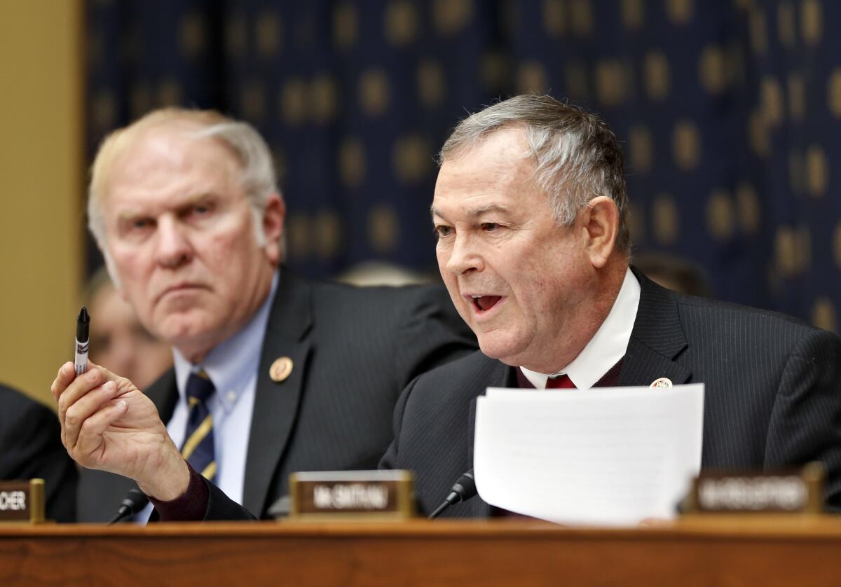 Rep. Dana Rohrabacher questions then-Secretary of State Hillary Rodham Clinton during a House Foreign Affairs Committee hearing.