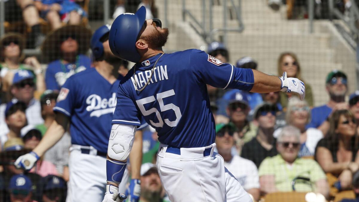 Dodgers' Russell Martin watches his pop up in the first inning of a spring training game in Glendale, Ariz.
