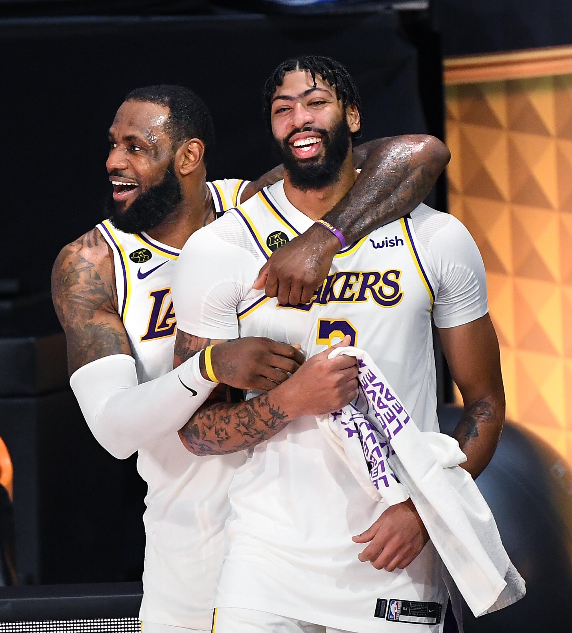 LeBron James, left, and Anthony Davis celebrate in the closing , moments of Game 6 of the NBA Finals