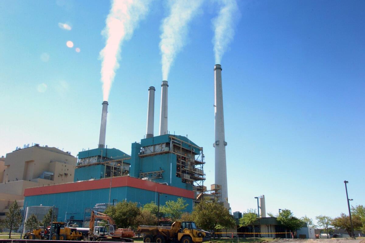 Smoke rises from the Colstrip Steam Electric Station, a coal burning power plant in in Colstrip, Mont.