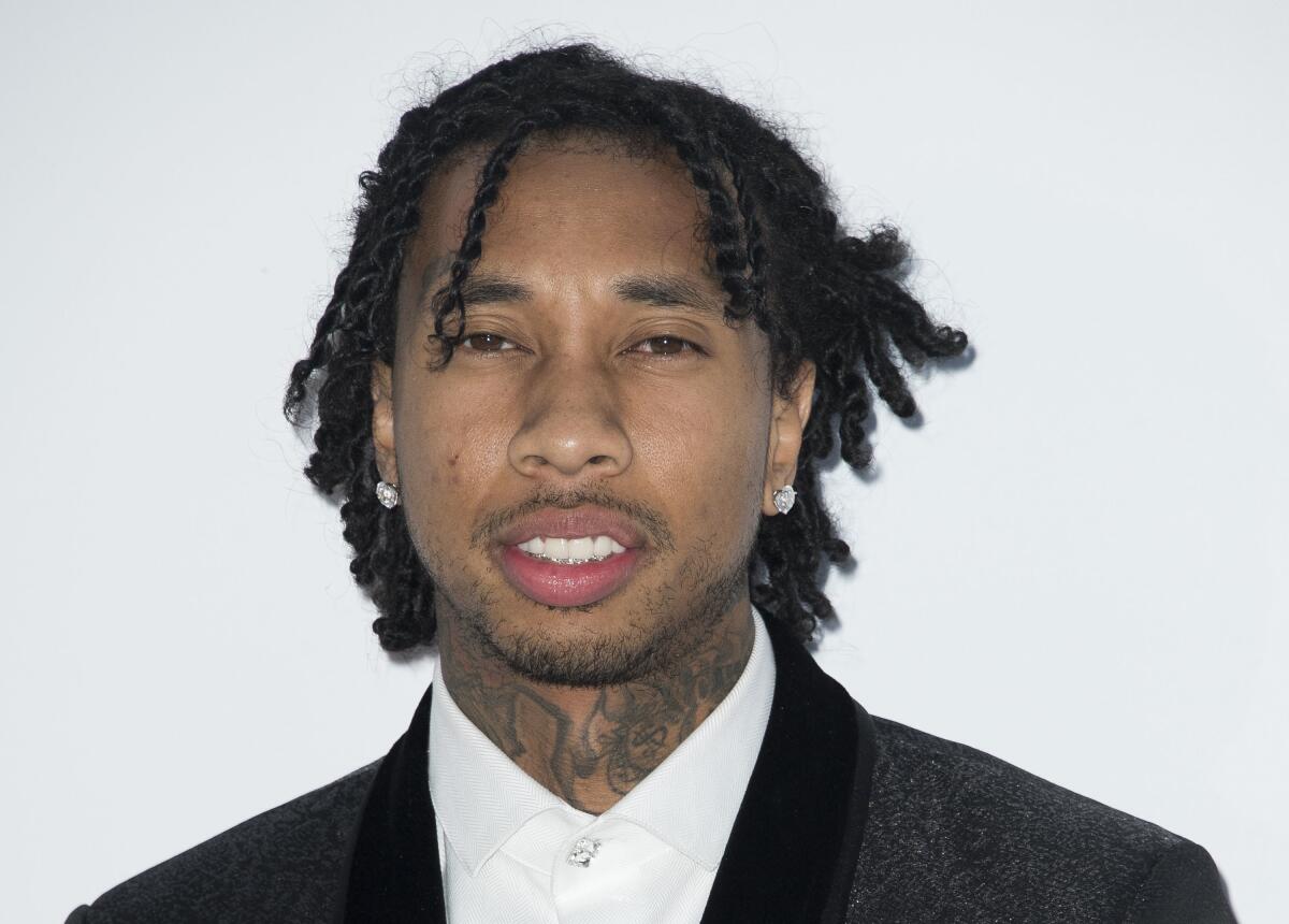 FILE - Tyga arrives at the amfAR, Cinema Against AIDS benefit during the 71st international Cannes film festival, in Cap d'Antibes, southern France on May 17, 2018. Authorities say the rapper has been arrested for investigation of felony domestic violence. Los Angeles police say the 31-year-old, whose legal name is Michael Stevenson, was booked for an incident that occurred on Tuesday, Oct. 12, 2021, in the Hollywood section of Los Angeles. He was released after posting $50,000 bond. (Photo by Arthur Mola/Invision/AP, File)