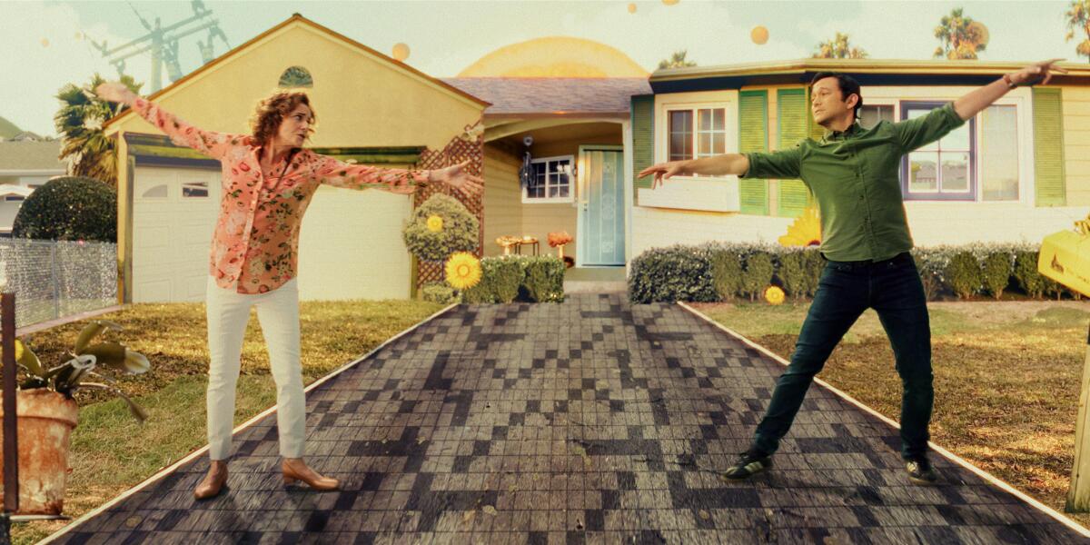 A mother and son dance in a cartoon driveway in front of a one-level California house