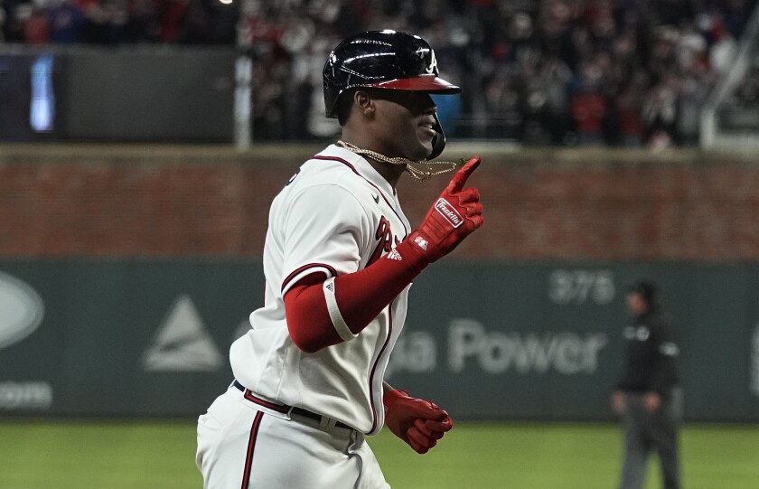 Atlanta's Jorge Soler celebrates after hitting a solo home run during the seventh inning of Game 4 of the World Series.