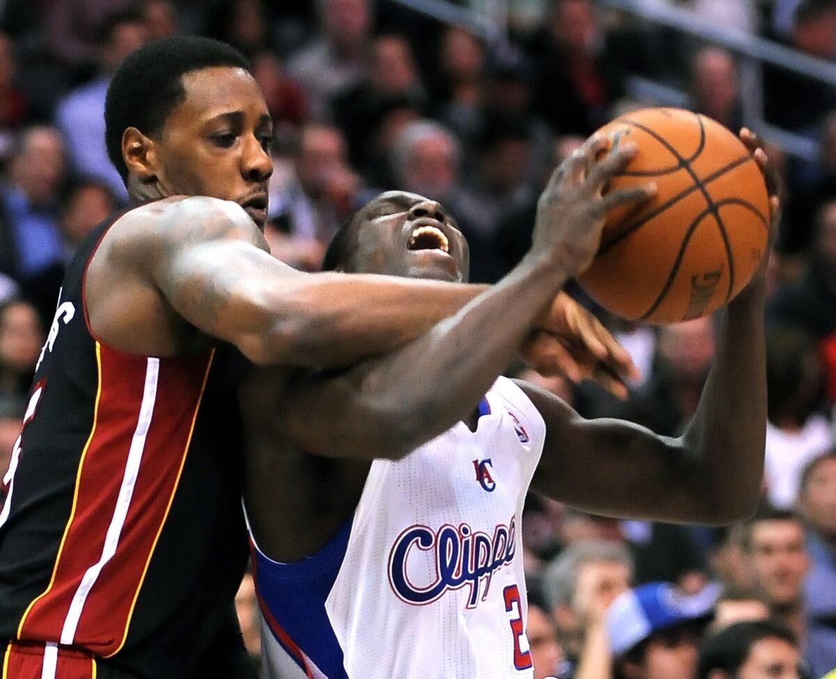 Miami's Mario Chalmers fouls Darren Collison during the Clippers' 116-112 loss Wednesday to the Heat at Staples Center.