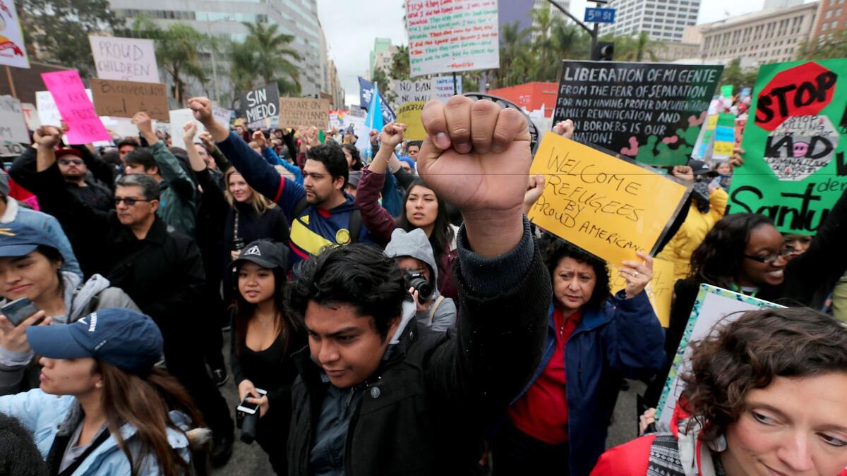 Protesters in downtown Los Angeles march against President Trump's immigration policies, including the border wall and the Musilm ban, on Feb. 18.