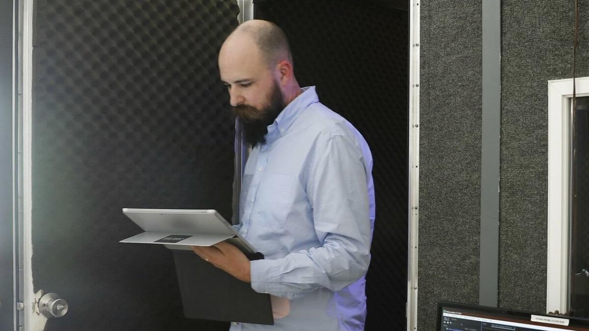 Jesse Thorn, co-host and co-executive director of podcasting production company Maximum Fun, exits the recording booth at the L.A. office on Oct. 23.