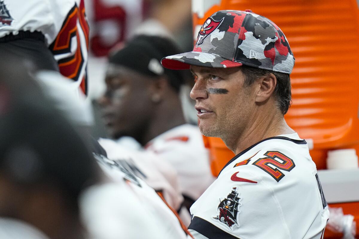 Tampa Bay Buccaneers quarterback Tom Brady (12) sits on the bench in the second half of an NFL preseason football game against the Indianapolis Colts in Indianapolis, Saturday, Aug. 27, 2022. (AP Photo/AJ Mast)