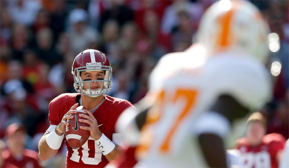 Alabama quarterback A.J. McCarron completed 19 of 27 passes for 275 yards and two touchdowns in the Crimson Tide's 45-10 win over the Tennessee Volunteers on Saturday.