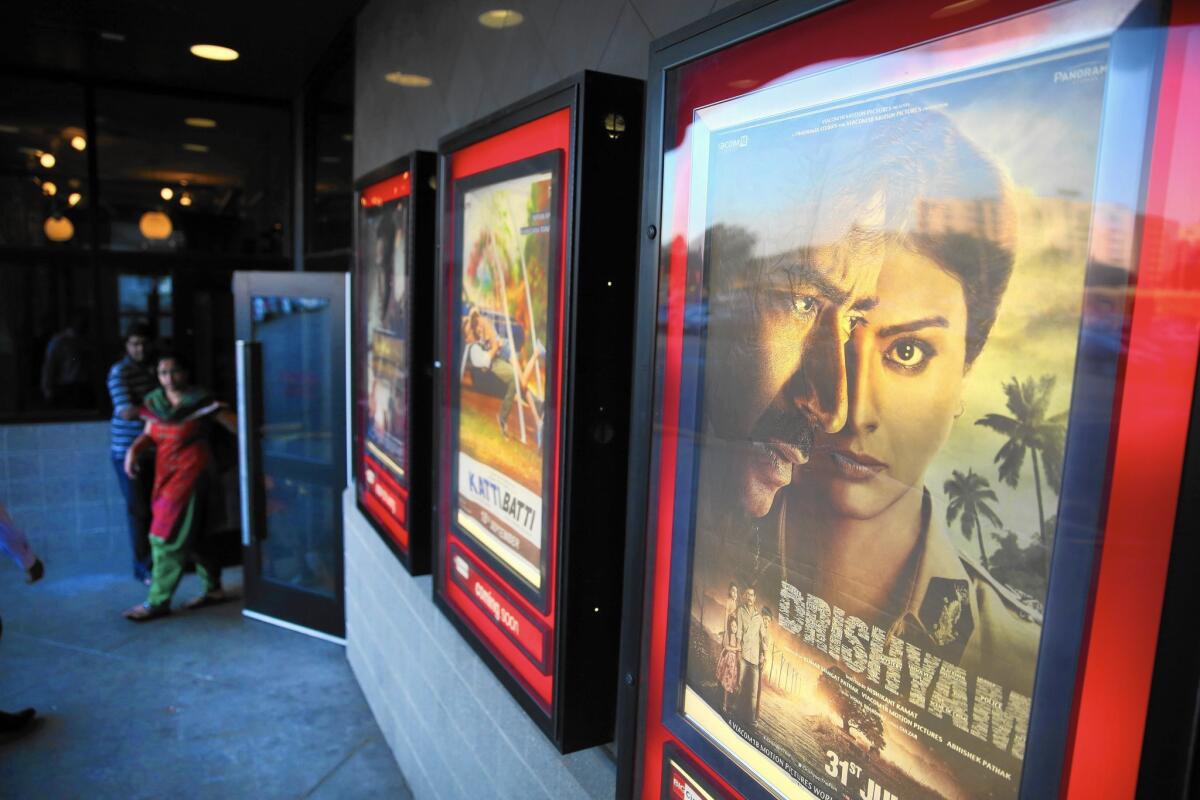 Posters adorn the Moviemax Cinemas in the Chicago suburb of Niles, Ill. The theater presents mostly Indian films to a majority South Asian audience.