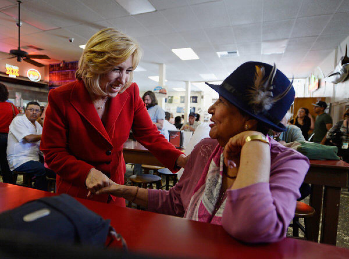 Los Angeles mayoral candidate Wendy Greuel greets Angela Duran, 82, during a campaign stop at Phillipe restaurant.