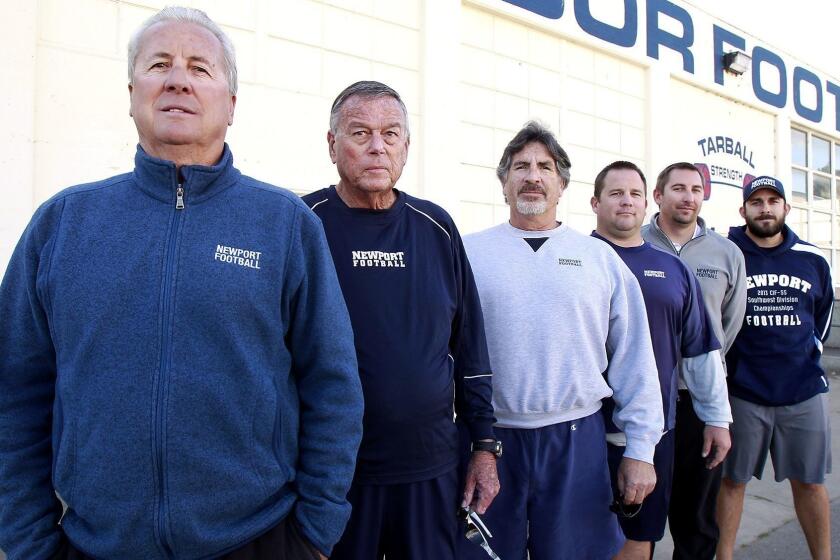 Newport Harbor High football coach Jeff Brinkley has led the Sailors to their eighth CIF Southern Section finals appearance in his 28 years in charge. Brinkley stands with longtime assistants, Bill Brown (28 years), Tony Ciarelli (20 years), Matt Burns (15 years), Garrett Gouvaars, and Chris Anderson, left to right, help him along the way.