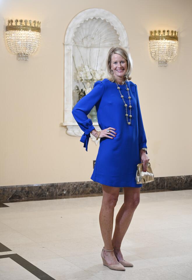 Who: Holly Hoey, 48, Roland Park resident, United Way of Central Maryland senior vice president Spotted at: The Great Chefs’ Dinner at The Grand Lodge of Maryland, benefiting The Family Tree What she wore: Banana Republic cobalt dress with ¾ length tie sleeves; J.Crew gold glitter clutch; Franco Sarto nude suede heels with ankle straps from DSW; long gold necklace she bought at a holiday bazaar; and Julie Vos gold bangles and cocktail ring from Becket Hitch. She goes for things with a little something extra: “I like pieces with a flair to them, like the sleeves on this dress. I like chunky, statement jewelry or clothes with interesting stitching.”