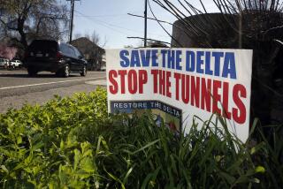 FILE - In this Feb. 23, 2016, file photo, a sign opposing a proposed tunnel plan to ship water through the Sacramento-San Joaquin Delta to Southern California is displayed near Freeport, Calif. The powerful Metropolitan Water District voted Tuesday, Oct. 10, 2017 to pay its share of the $16 billion project to build two massive tunnels to pipe water from Northern California to Southern California cities. The vote gives Gov. Jerry Brown's ambitious project an important boost of support after an influential agricultural group withdrew its support last month. The tunnels, which have been discussed in one form or another for generations, would pipe water around the Sacramento-San Joaquin Delta — where Sierra Nevada water flows toward the sea — to a system of canals that deliver water to farms and residents mostly in the southern half of the state. (AP Photo/Rich Pedroncelli, File)