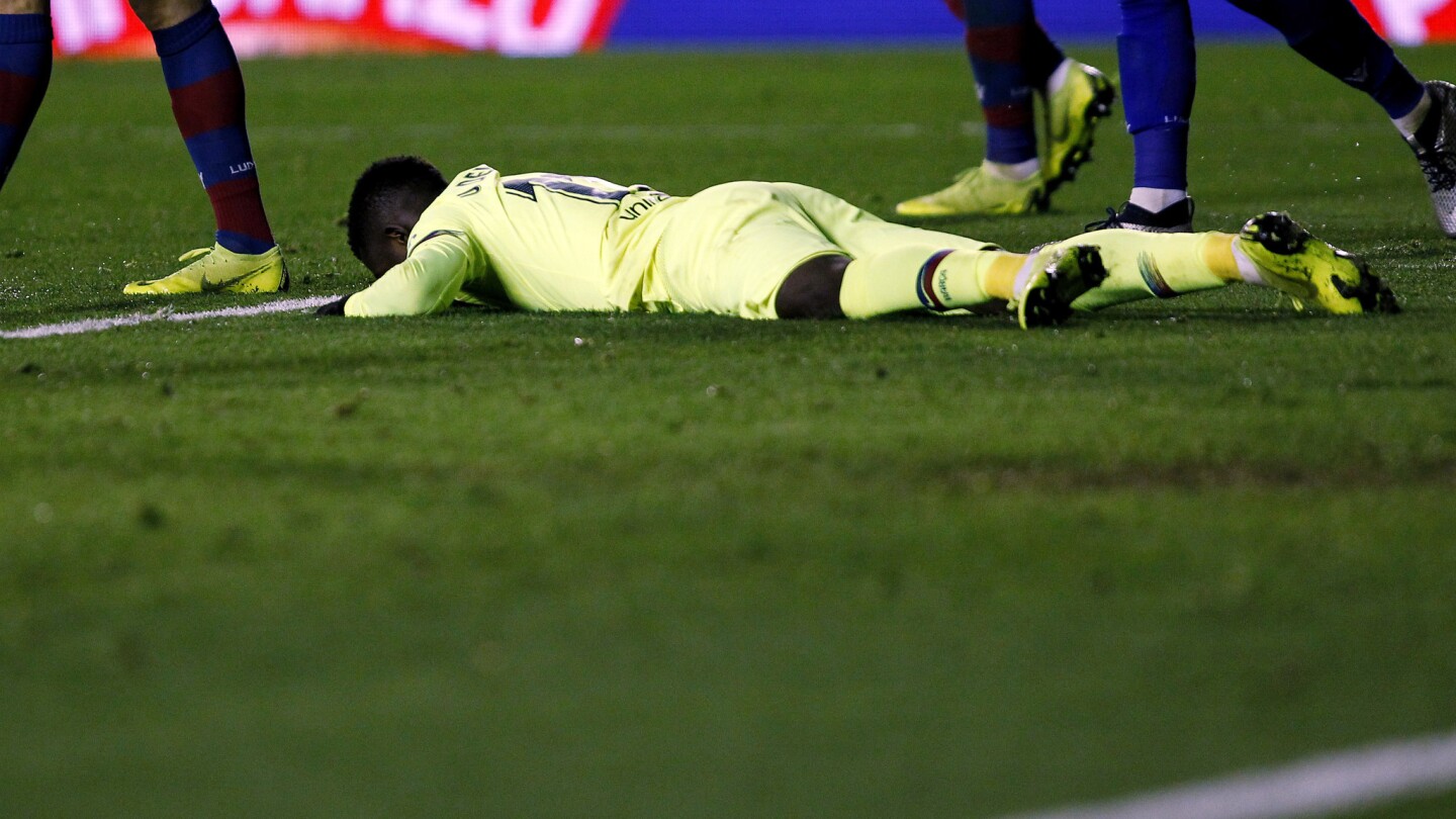 Barcelona forward Ousmane Dembele reacts after failing to score against Levante during the la Copa del Rey round of 16 first leg soccer match between Levante and Barcelona at the Ciutat de Valencia stadium in Valencia, Spain, Thursday, Jan. 10, 2019. (AP Photo/Alberto Saiz)