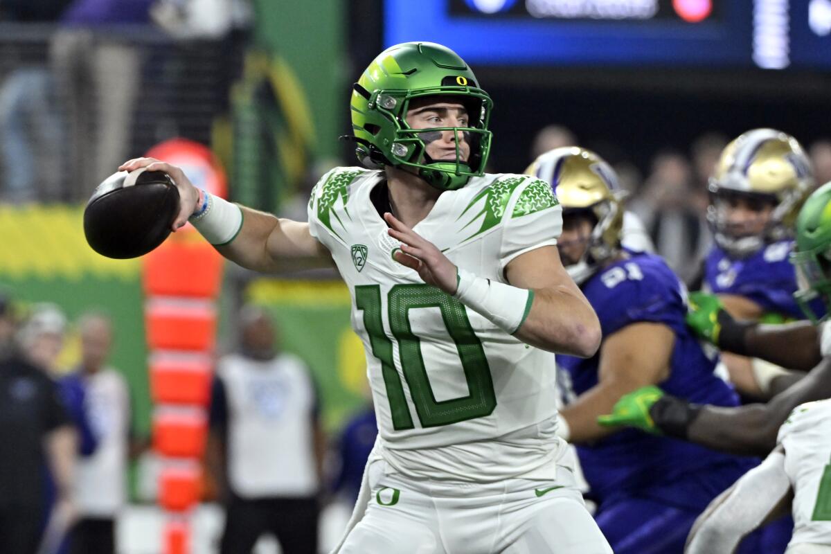 Oregon quarterback Bo Nix dejected after loss in Pac-12 championship, mum  on status for bowl game - The San Diego Union-Tribune