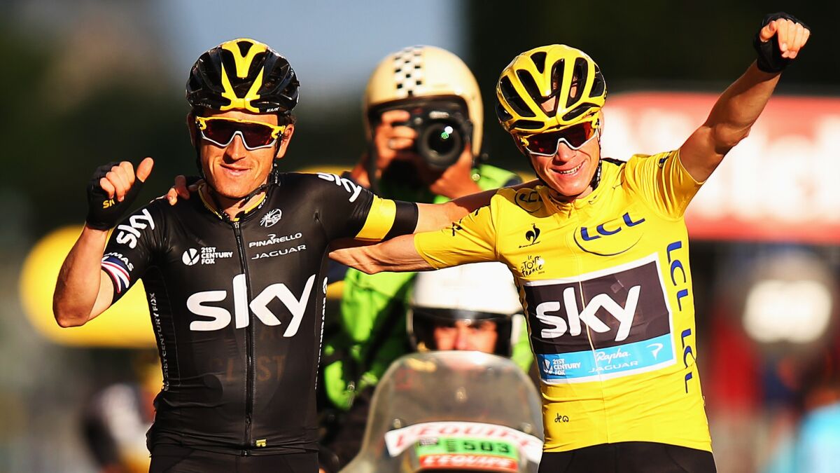 Tour de France winner Chris Froome, right, celebrates with Team Sky teammate Geraint Thomas at the end of the final stage of the race in Paris on Sunday.