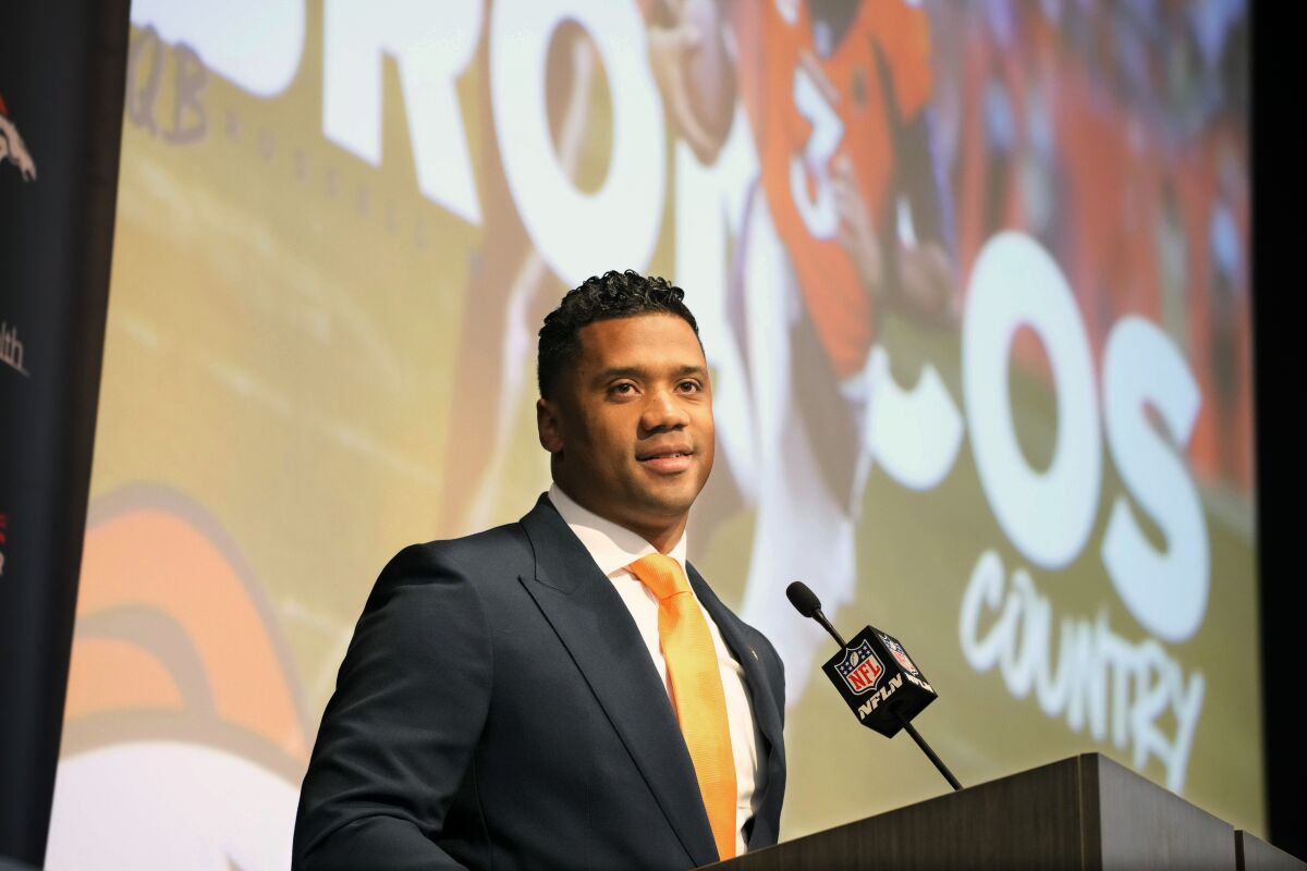 Denver Broncos new starting quarterback Russell Wilson speaks during a news conference Wednesday, March 16, 2022, at the team's headquarters in Englewood, Colo. (AP Photo/David Zalubowski)