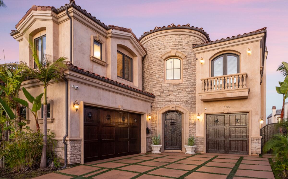 The waterfront home comes with a private dock overlooking Huntington Beach Harbor.