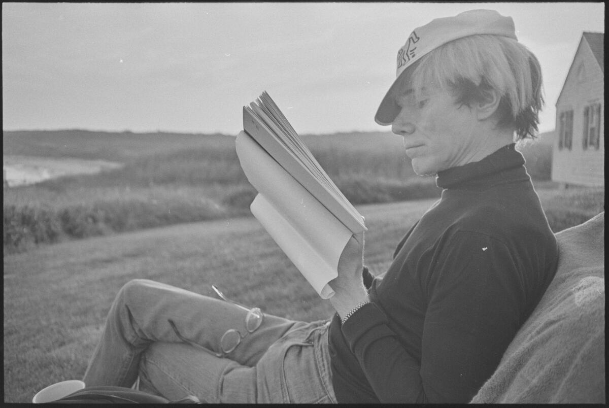 Andy Warhol reading.