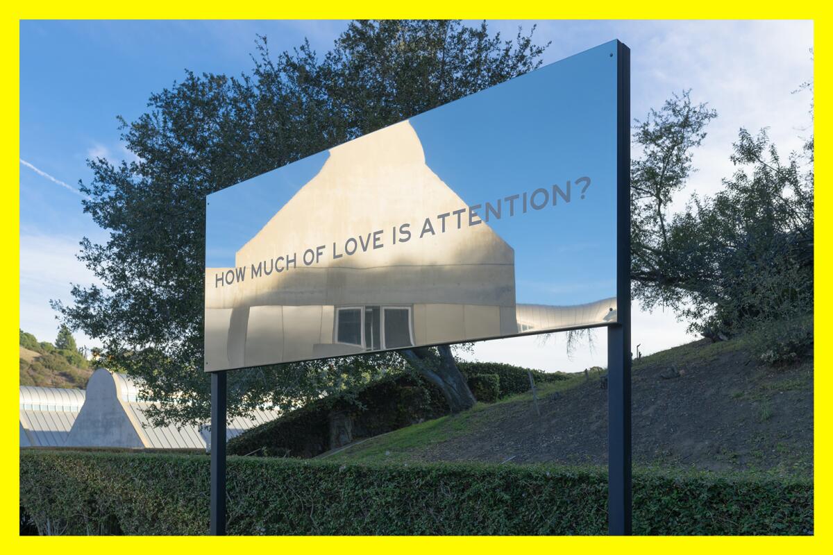 A mirrored sign reads, "How much of love is attention?"