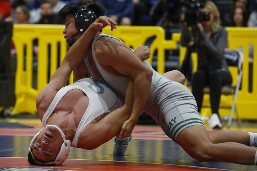 919121-sd-sp-cif-wrestling_NL February 19, 2022 San Diego, CA CIF Masters wrestling at Christian High School in El Cajon with winners moving on to state tournament. Here, Poway's Noah Tolentino (top) gets the better of San Ysidro's Santiago Luna as Tolentino wins the 145 weight class. © 2022 Nancee Lewis / Nancee Lewis Photography