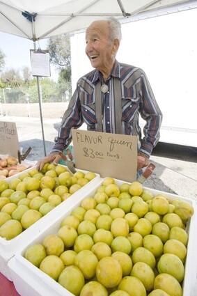Harry Nicholas of Orange Cove sells Flavor Queen Pluots at the Beverly Hills farmers market.